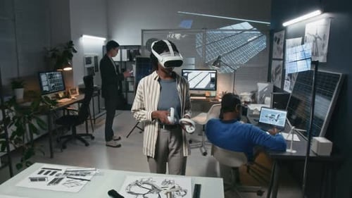 Clean Energy Engineer Using VR Gear in Sustainable Technology Office