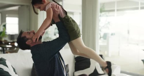 Father and Daughter Playful Embrace in Modern Home