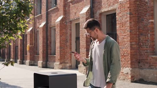 Man Throws Chocolate Bar Away in City