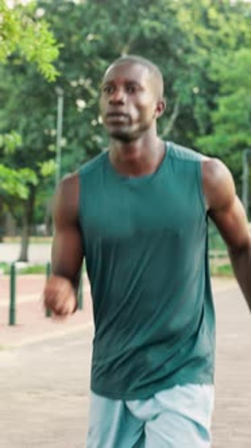 Runner, fitness and man with running at park for pace training, endurance challenge or cardio