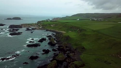 Cinematic aerial view of rocky coastline in northern Ireland