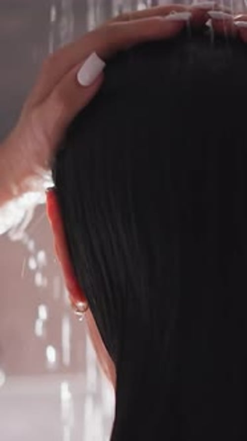 Close Up Woman Massaging Wet Hair in Shower