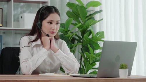 Focused Young Woman Working from Home Office