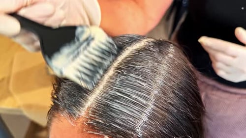 Woman Getting Hair Dyed at Home
