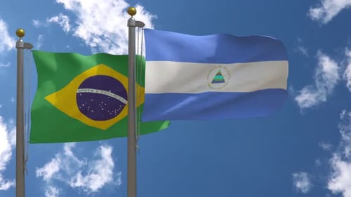 Brazil and Nicaragua Flags Waving on Flagpoles Against Blue Sky