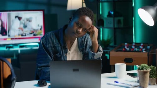 Woman Works at Laptop in Dark Home at Night