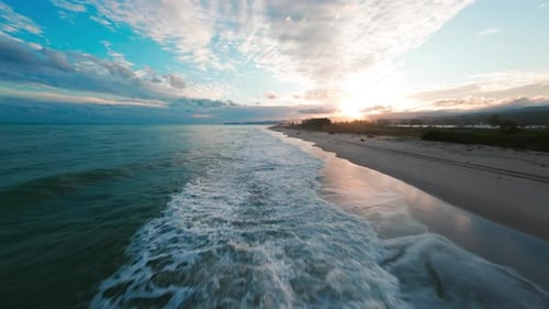 Sea Waves Crash on the Beach After a Relaxing Sunset in Nature Aerial
