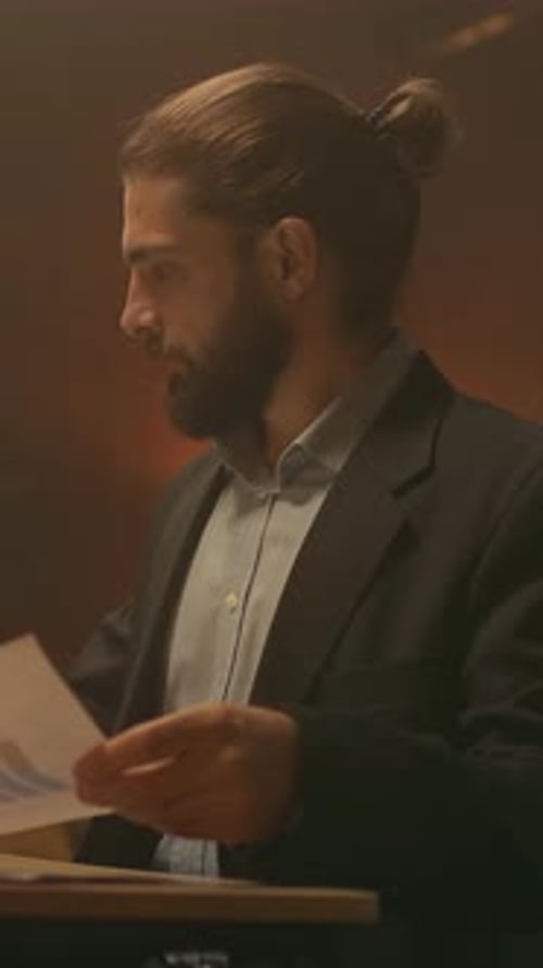 Nighttime Business Analysis Session Late Night Office Staff Reviewing Documents Under Soft