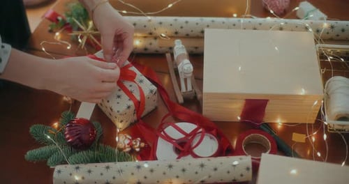 Tying Bow on Christmas Gift, Close Up