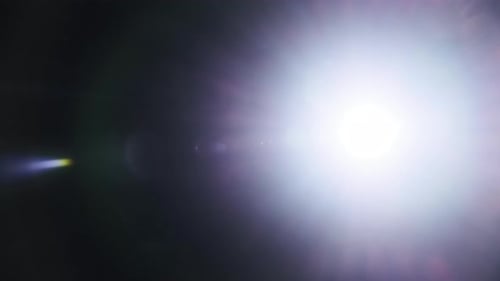 The Light of a Flashlight Into the Camera on a Black Background