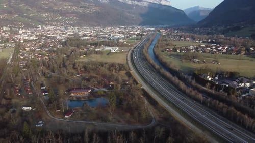 Flying backwards revealing the town of Sallanches and the Arve valley, as well as the Aravis