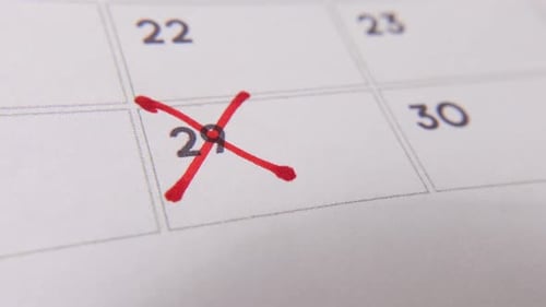 Marking the date number 29, focusing on the number highlighted with a red cross