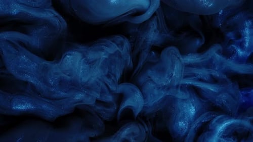 Abstract Blue Glitter Ink Flowing