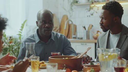 Friends and Family Sharing Meal at Home