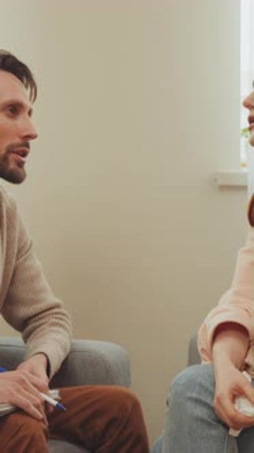 Man and Woman Talking in Therapy Session