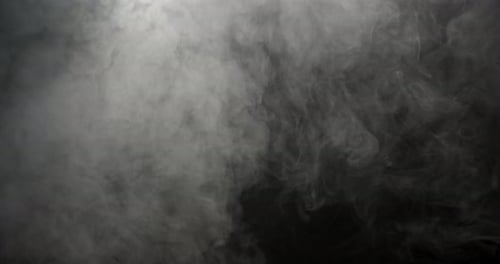 Abstract White Smoke Drifting on Black Background
