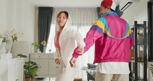 Young Adults Dancing Together in a Home