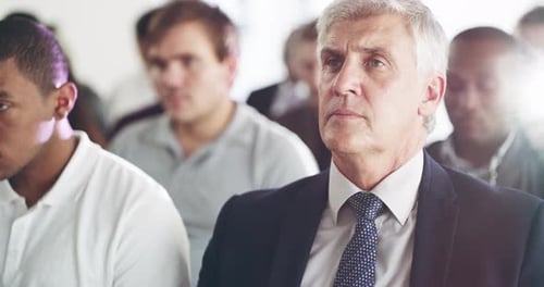 Adults Attending a Business Conference or Meeting