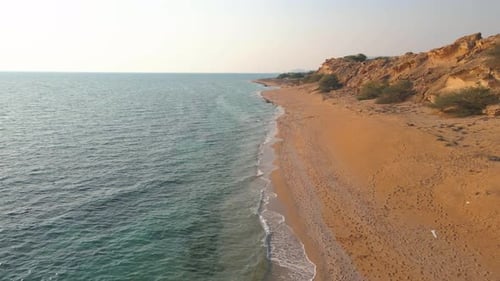 Aerial Shot of a Remote Rocky Beach and Crystal Clear Water