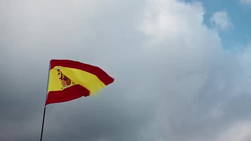 Spanish Flag Waving Proudly in the Wind
