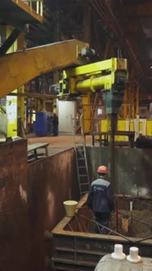 Foundry Workers Pouring Molten Metal Into Mold Stock Clip