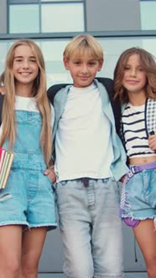 Happy Young Students Posing Together at School