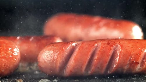 Sausages are Fried with Splashes in a Pan Filmed on a Highspeed Camera at 1000 Fps
