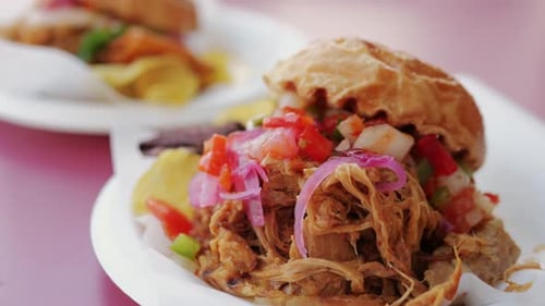 Burger with Pulled Pork Meat Close Up of a Fresh Mexican Cuisine Cheese on Paper for Sale at a