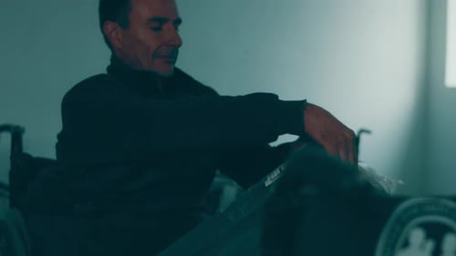 A Disabled Man Assembles a Stroller