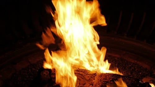 Blazing Campfire with Fiery Flames at Night