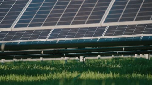 Solar panels in a green field harnessing sunlight for clean energy