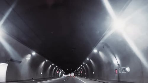 Drive through the illuminated tunnel.