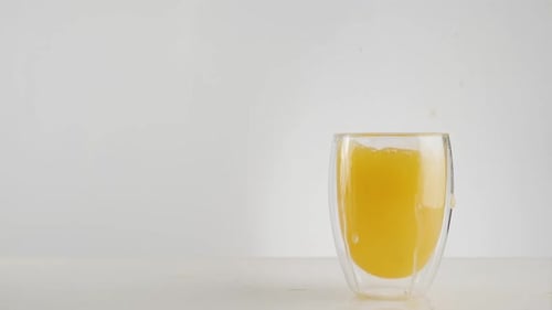 Refreshing Orange Juice Splash in Glass