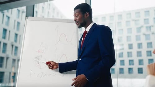 Business Coach Performing in Office Teaching Businessmen or Professionals African American Man