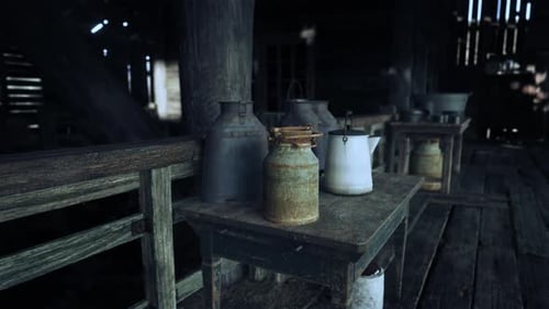 Rustic Barn Interior with Old Farm Equipment and Milk Cans