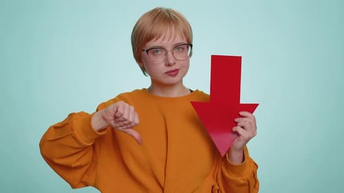 Upset Sad Woman Showing Red Arrow Pointing Down Concept of Downgrade Bankruptcy Money Fail Fall