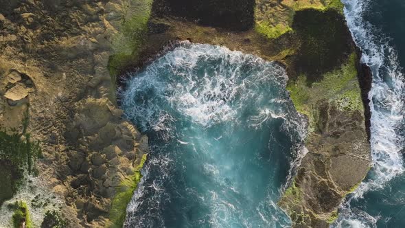 Aerial ascent above Devil's Tears cliffs, showing waves erupting into ...