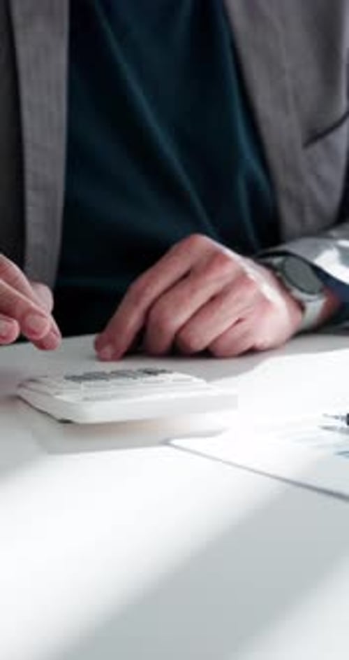 Paperwork, hands or typing on calculator at desk,
medical insurance or healthcare coverage plan