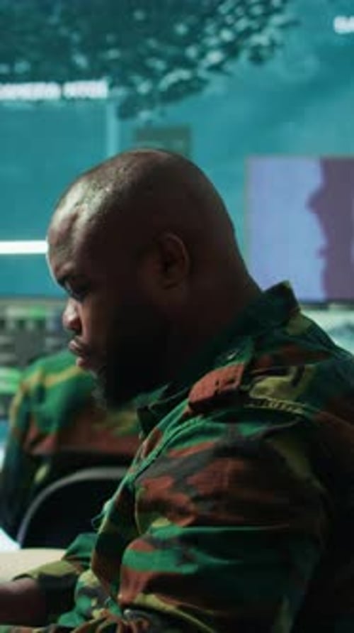 Adult Works at Computer in Modern Workplace