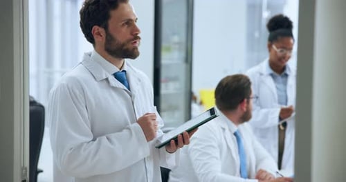 Medical Professionals Work in Bright Modern Laboratory