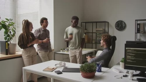 Coworkers Chatting during Coffee Break at Programmers Office