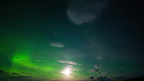 Nothern lights in Arctic. Timelapse of the sky with Aurora Borealis shining green.