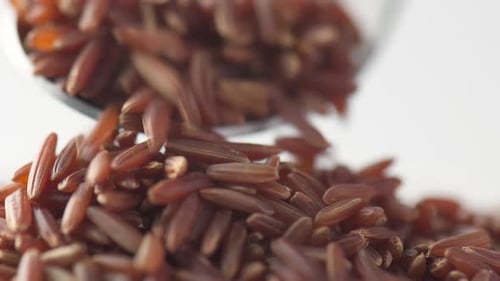 Brown Rice Grains Cascading in Delicious Close Up