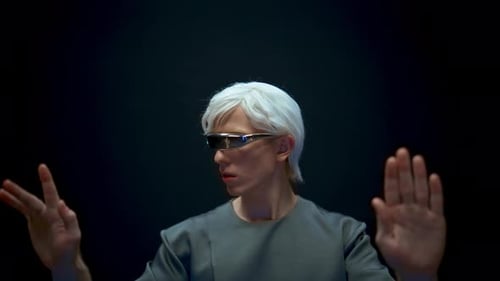 Man in Futuristic Glasses Interacts with Virtual Interface