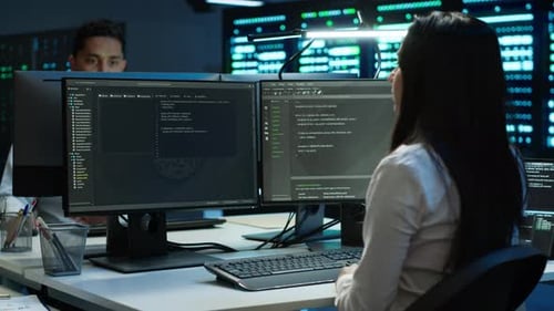 Team of Technicians in Data Center Managing Infrastructure