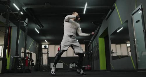 Man Boxing and Working Out in the Gym