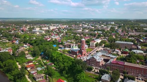 Top view of old town with red monastery on summer day
