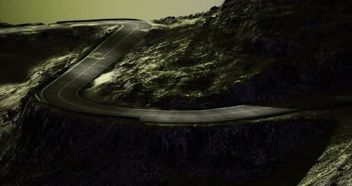 Winding Road Through Rugged Landscape Under a Mysterious Twilight Sky