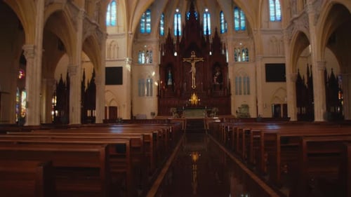 The inside of the church is new with empty pews. Dolly shot