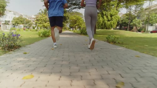 Athletes Preparing for Marathon in City Park